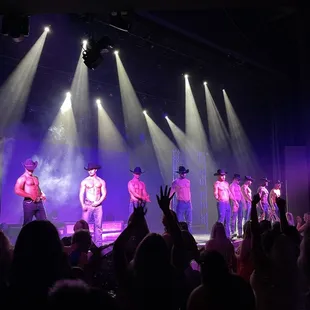 a group of men on stage