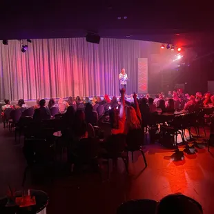 a crowd of people sitting at tables