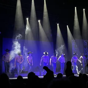 a group of dancers on stage