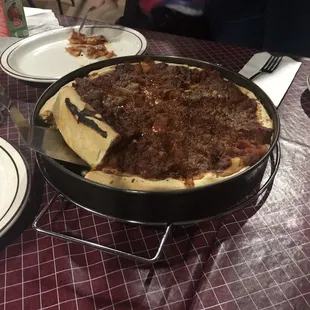 a deep dish pizza on a table