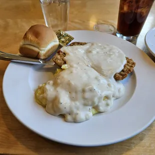 Chicken fried steak with mashed potatoes and gravy.