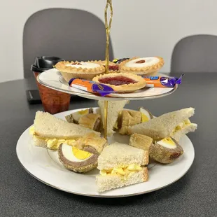 High Tea (tea, Bakewell Tarts, Jamwell Tarts, Eclairs, Fudge, egg salad sandwiches, sausage rolls, and scotch eggs).