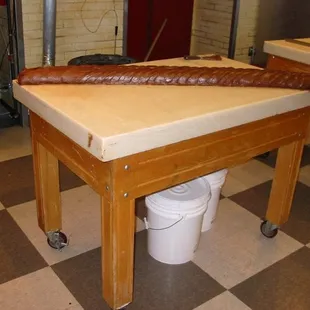 After this long loaf of fudge cools, someone will return to cut it into slices as large as baker's bread..