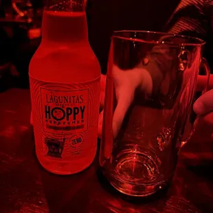 a bottle and a glass on a table