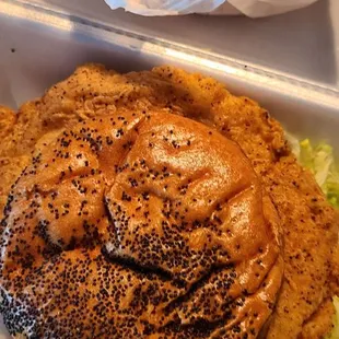 Fried Chicken Sandwich and shoestring onions.