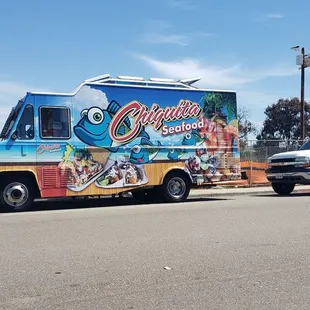 a food truck parked on the side of the road