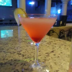 a cocktail in a martini glass