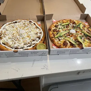 Chicken mole and al pastor pizzas.