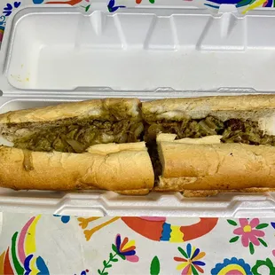 Mexican Cheesesteak - fried onion, cilantro, chihuahua cheese, and creamy jalapeño salsa.