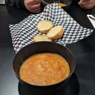 a man eating a bowl of soup
