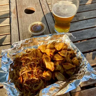 a plate of food and a beer