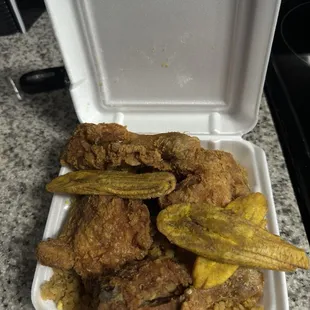 Four piece Fried chicken with fried rice and Tostones
