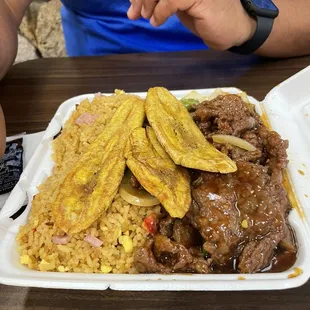 Pepper, steak and fried rice and Tostones.