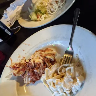 a plate of pasta and a fork
