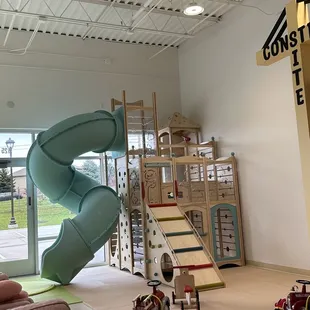 a play area with a slide