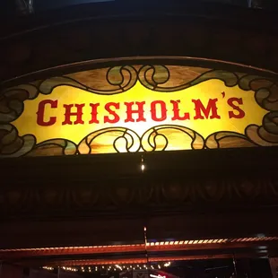 a stained glass sign above the bar