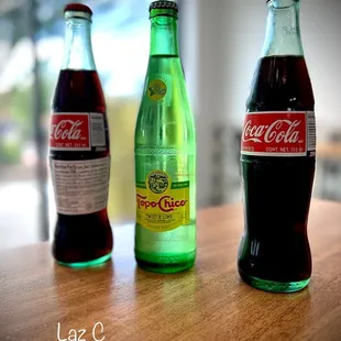 three bottles of coca cola