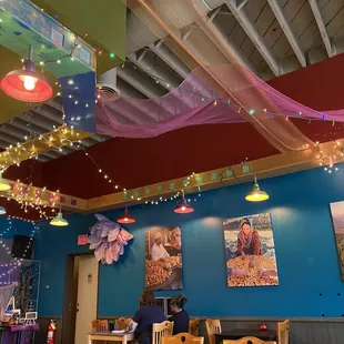 a dining area with tables and chairs