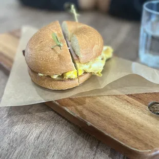Plain bagel with ham, American cheese &amp; eggs.