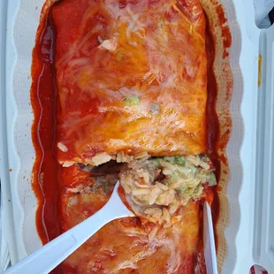 Wet burrito with carne asada with innards exposed