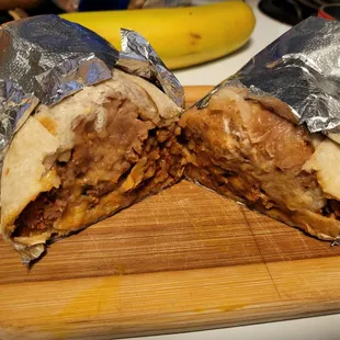 Al Pastor Regular burrito ($12.15 + $.65 for sour cream)  rice, beans, cheese, meat. Hearty and flavorful.