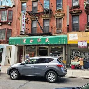 a car parked in front of a building