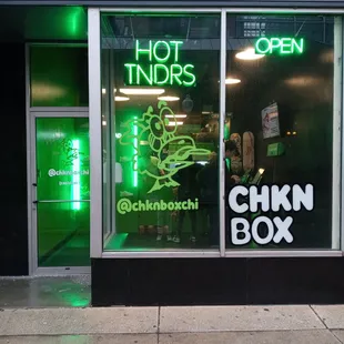 a neon sign in the window