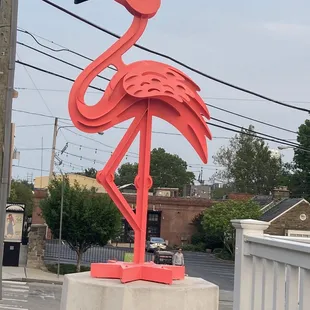 a pink flamingo statue