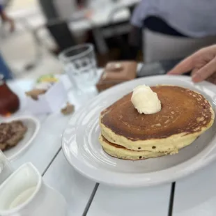 a plate of pancakes with butter