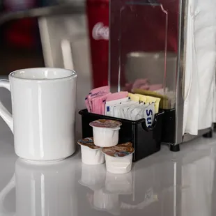 a cup of coffee and a coffee maker