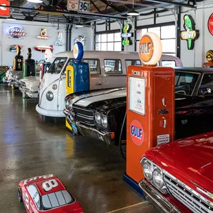 a row of classic cars in a garage