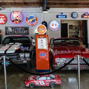 several classic cars in a garage