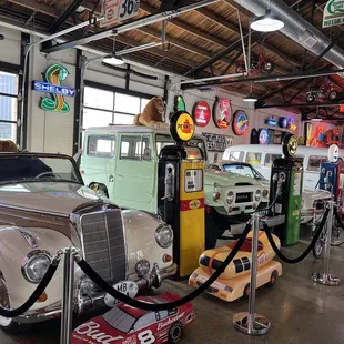 a row of classic cars in a garage