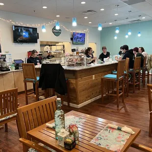 people sitting at the bar