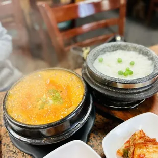 three bowls of soup on a table