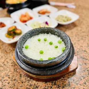 a bowl of rice with peas