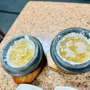 two bowls of soup on a table