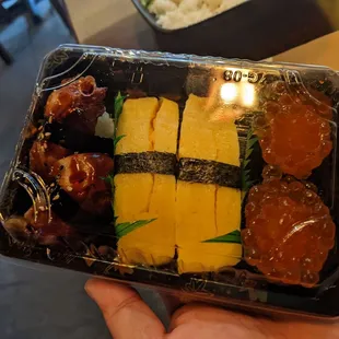 Eel, egg, salmon roe sushi to go