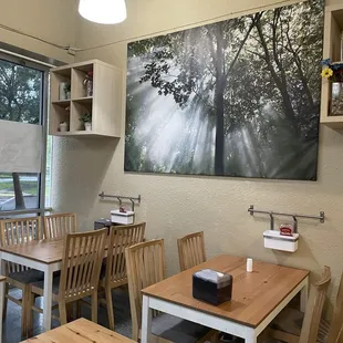 a dining room with tables and chairs