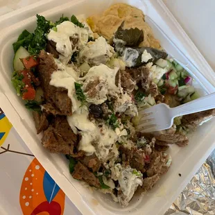 Lamb Gyro Platter half eaten so good