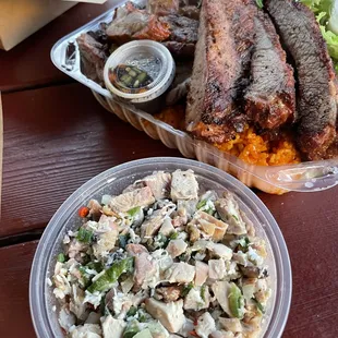 Chicken kelaguen at the bottom and Fiesta Plate on top.