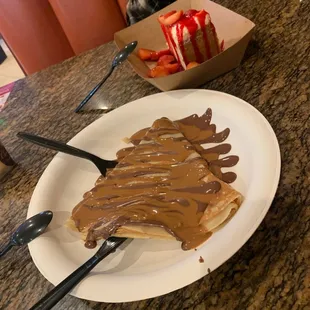 Nat Nutella Classic Crepe and Lotus Crepe. Stawberry cheesecake. Vanilla ice cream.