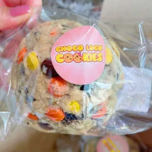 a person holding a cookie