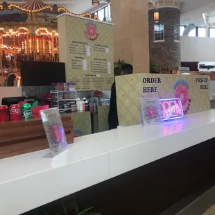 Located behind the carousel