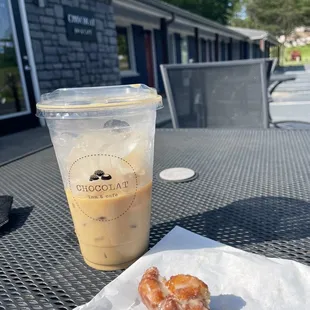 a cup of coffee and a doughnut