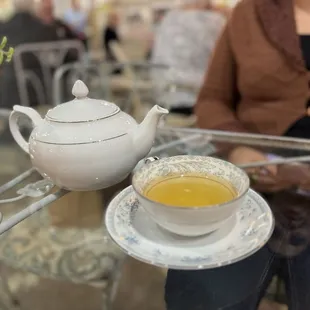 a cup of tea and a teapot