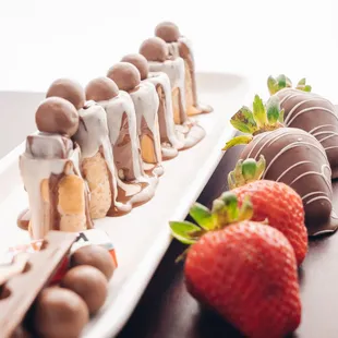 a row of chocolate covered strawberries