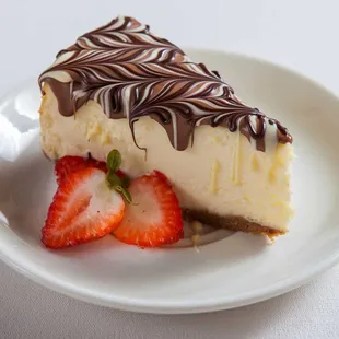 a slice of cheesecake with strawberries