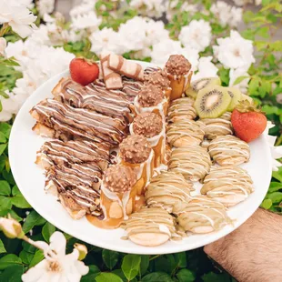 a plate of pastries and fruit