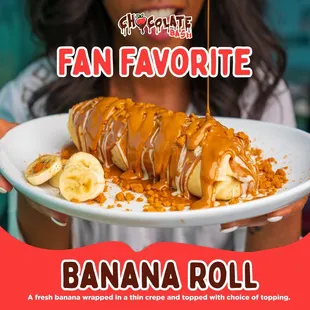 a woman holding a banana roll